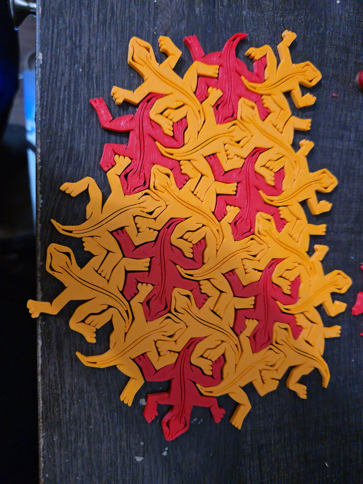 Second view of the completed orange M.C. Escher Tessellation toy 3D model